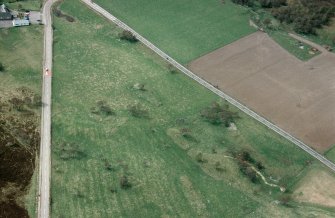 An oblique aerial view of Chapleton, Boat of Garten, Duthil and Rothiemurchus, Badenoch and Strathspey, looking W.