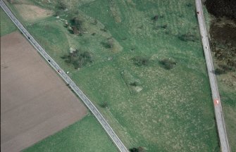 An oblique aerial view of Chapleton, Boat of Garten, Duthil and Rothiemurchus, Badenoch and Strathspey, looking NE.