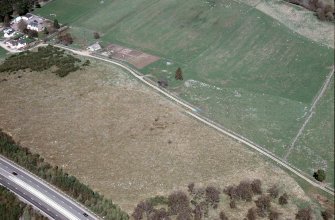 An oblique aerial view of Raigbeg, Moy and Dalarossie, Inverness, looking NE.