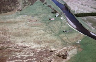 An oblique aerial view of Lower Inverborough, Moy and Dalarossie, Inverness, looking ESE.