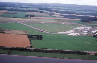 Aerial view of Dalcross Airfield, E of Inverness, looking S.