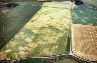 An oblique aerial view of Kinchyle, Croy and Dalcross, Nairn, looking NW.