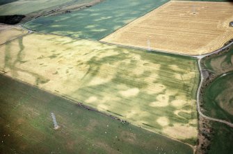 An oblique aerial view of Kinchyle, Croy and Dalcross, Nairn, looking NE.