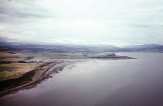 An oblique aerial view of Alturlie Point, Petty, Inverness, looking SW.