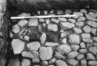 Excavation of the cobbled apron and interior of the N stable and the stable forestair. Detail of the well, and the cobbled drain and sump in the parade ground.