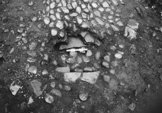 Excavation of the cobbled apron and interior of the N stable and the stable forestair. Detail of the well, and the cobbled drain and sump in the parade ground.