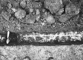 Excavation photograph - Trench I: vertical shot of stone hole within mortar mass Il