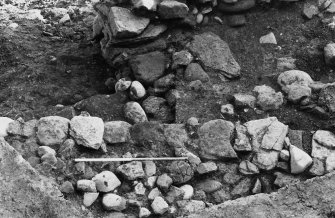 Excavation photograph : wall 23, tumble 25, blocking 42, fill 29.