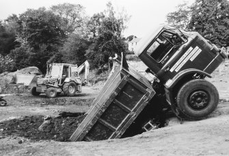 Jedburgh Abbey excavation archive
Frames: 3-8: Lorry in collapsed mill lade
Frame 9: Collapsed mill lade after removal of lorry
Frames 10-11: Assembling for team photographs
Frames 13-14: Team photographs
Frames 15-17: Area 1: E range and Trench J in September 1984. From N.
