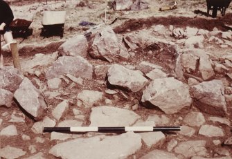 Area 2 F2025 & 2058  Rubble left within wall detail by entrance, from SW