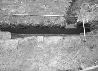 Culross Palace, Fife, Bessie Bar Hall Excavations 1993
Bessie Bar Yard
Frame 00: Culvert F926 at S end of F911
Frame 0: same description as 00
Frame 1: same description as 00
Frame 2: Fireclay pipe being removed from F904
Frame 3: same description as 2 
Frame 4: Section along 5m line, down to surface F927, from S
Frame 5: duplicate of 4
Frame 6: same description as 4
Frame 7: Surface F927, from W
Frame 8: same description as 7
Frame 9: Stone lined tank F929, from N
Frame 10: same description as 9
Frame 11: same description as 9
Frame 12: Part of stone lined tank F929, from W
Frame 13: Last remnant of F911 excavated from 5m line
Frame 14: Same description as 13
Frame 15: same description as 13
Frame 16: Complex of drains in SE corner of yard, from W
Frame 17: Base of wall on W side of palace
Frame 18: same description as 17
Frame 19: Surface F927 below cobbles F910
Frame 20: same description as 19
Frame 21: W side of yard with plastic drain pie installed, from E
Frame 22: Shots of stone tank F929
Frame 23: same description as 22
Frame 24: same description as 22
Frame 25: same description as 22
Frame 26: same description as 22
Frame 27: End of wall F936 
Frame 28: same description as 27
Frame 29: Section at N end of service trench
Frame 30: same description as 29
Frame 31: Culvert F939
Frame 32: same description as 31
Frame 33: same description as 31