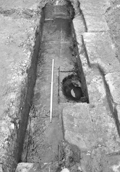 Culross Palace, Fife, Bessie Bar Hall Excavations 1993
Bessie Bar Yard
Frame 00: Culvert F926 at S end of F911
Frame 0: same description as 00
Frame 1: same description as 00
Frame 2: Fireclay pipe being removed from F904
Frame 3: same description as 2 
Frame 4: Section along 5m line, down to surface F927, from S
Frame 5: duplicate of 4
Frame 6: same description as 4
Frame 7: Surface F927, from W
Frame 8: same description as 7
Frame 9: Stone lined tank F929, from N
Frame 10: same description as 9
Frame 11: same description as 9
Frame 12: Part of stone lined tank F929, from W
Frame 13: Last remnant of F911 excavated from 5m line
Frame 14: Same description as 13
Frame 15: same description as 13
Frame 16: Complex of drains in SE corner of yard, from W
Frame 17: Base of wall on W side of palace
Frame 18: same description as 17
Frame 19: Surface F927 below cobbles F910
Frame 20: same description as 19
Frame 21: W side of yard with plastic drain pie installed, from E
Frame 22: Shots of stone tank F929
Frame 23: same description as 22
Frame 24: same description as 22
Frame 25: same description as 22
Frame 26: same description as 22
Frame 27: End of wall F936 
Frame 28: same description as 27
Frame 29: Section at N end of service trench
Frame 30: same description as 29
Frame 31: Culvert F939
Frame 32: same description as 31
Frame 33: same description as 31