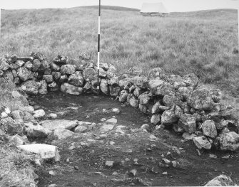 Excavation photograph : outhouse at Complex A traversed by foundations of an old dyke.