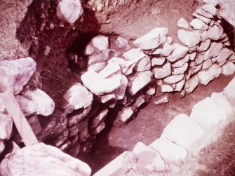 Excavation photograph : view down into souterrain.