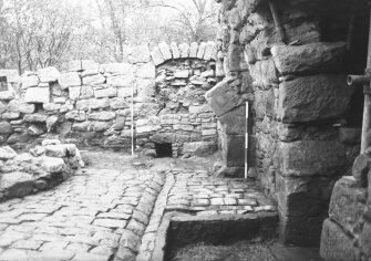 Craignethan Castle
Excavations 1984
Frame 28 - View along drain running along south side of basement - from north
