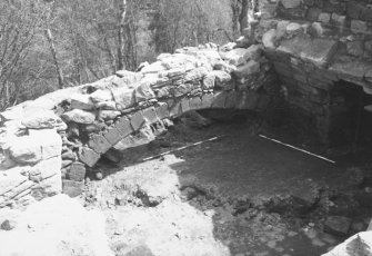 Craignethan Castle
Excavations 1984
Frame 33 - East side of basement showing kitchen fireplace - from north-east
