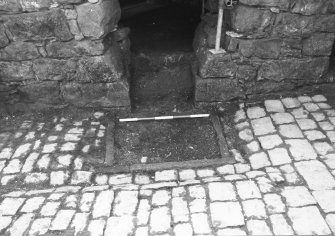 Craignethan Castle
Excavations 1984
Frame 1 - Fireplace and ash-pit in south wall prior to the excavation of the latter - from north



