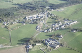 Aerial view of Croy Parish Church and village, near Dalcross, E of Inverness, looking SSW.