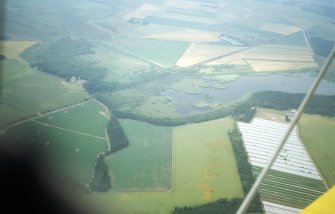 Aerial view of Spynie Palace and Loch Spynie, north of Elgin, Moray, looking NW.