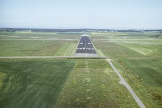 Aerial view of Dalcross (Inverness) Airport, E of Inverness, looking NE.