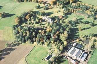 Aerial view of Fettercairn House, Gardens, and Fettercairn Mains Farm, Aberdeenshire, looking NW.