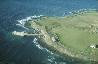 Aerial view of Pier and Ferry Terminal, Nouster, North Ronaldsay, Orkney, looking W.