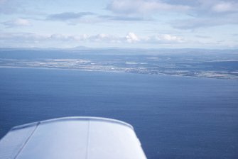 Distant aerial view of Nairn and the Moray Coast, looking SSE.