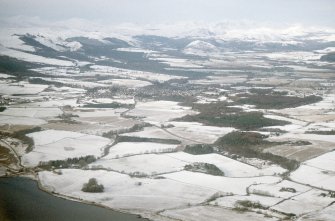 Aerial view of Tarradale and Muir of Ord under snow, Black Isle, looking NW.