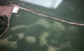 Aerial view of enclosure cropmark, Monboddo, north of Laurencekirk, Aberdeenshire, looking SW.