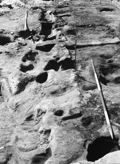 General views of site, structure 1, structure 2 and structure 3. Detail includes post holes, well 106, hearth 1054, pit 1017 and working shots.