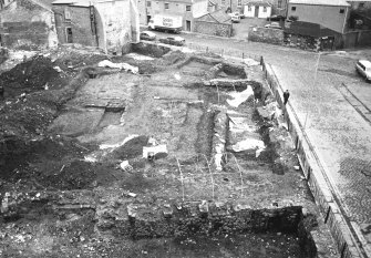 Skeletons SK11; area 2; grave 121; ditch 117 and stake holes 142-157 & 279; robber trench 109; general views; and oven 161.