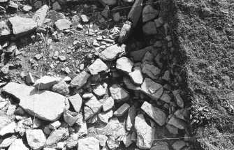 Excavation photograph ; trench Z - detail elevation of re-build L725 of inner broch wall prior to collapse.