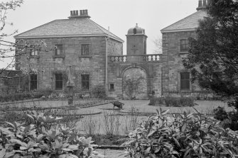 View of sundial and stables from South-West.