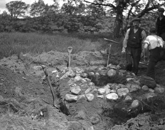 Inchmarnock, Remains of Chapel.
View of 3 men undertaking excavation.