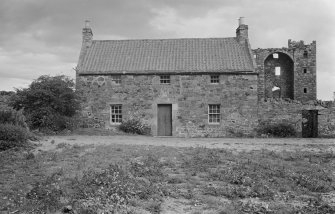 General view of cottage from west with Saltcoats Castle in the background.