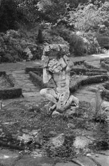 View of Atlas figure, Carberry Tower garden.