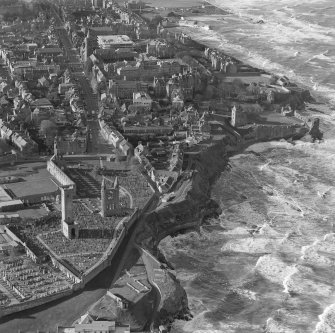 Oblique aerial view of St Andrews including Castle and Cathedral.