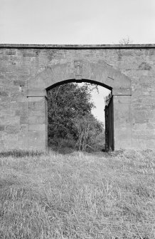 View of archway in garden wall, Amisfield House.