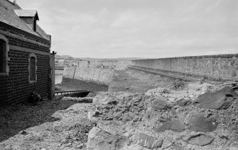 General view of lifeboat station and quay wall, Eyemouth.