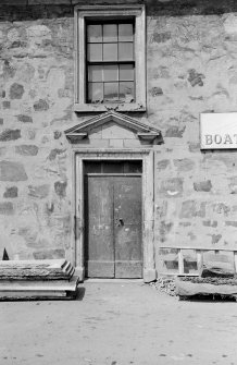 View of door with pediment and window above, Eyemouth Boat Building Company, Harbour Road, Eyemouth.