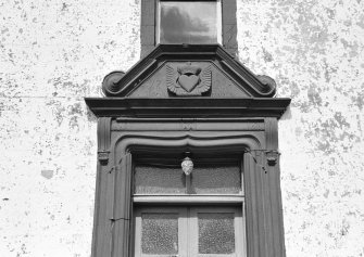 View of pediment above entrance doorway, south elevation, Ross Mains.