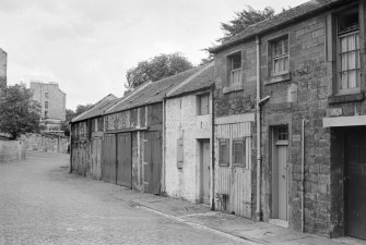 General view of coach houses, George Square Lane, Edinburgh, seen from the North West.