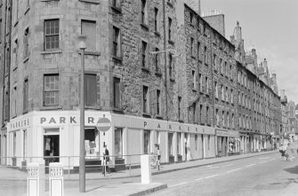 General view of shops at ground floor, 27-65 Bristo Street, Edinburgh, from south east, including Parkers department store.