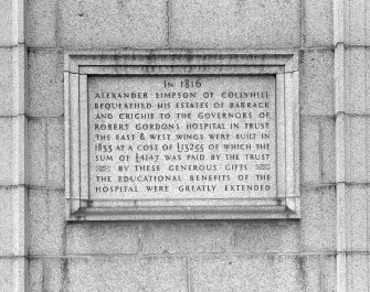 General view of plaque on East wall of West wing recording the building of the wings, 1830-33.
Insc: 'In 1816 Alexander Simpson Of Collyhill Bequeathed His Estates Of Barrack And Crichie To The   Govenors Of Robert Gordon's Hospital In Trust. The East & West Wings Were Built In 1833 At A Cost Of #13255 Of Which The Sum Of #4147 Was Paid By The Trust. By These Generous Gifts The Educational Benefits Of The Hospital Were Greatly Extended'.