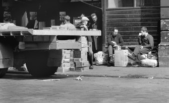 Glasgow, Candleriggs.
View showing street scene round fruit market