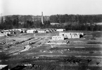 Almondbank, Royal Naval Stores Depot. View from S showing buildings under construction with the workers hutted camp in the background.  Also visible is the chimney of Porterfield Bleach works.