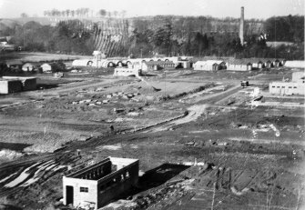 Almondbank, Royal Naval Stores Depot. View from SE showing cleared site prior to main construction with part of the hutted camp.  Also visible is the chimney of Porterfield Bleachworks.