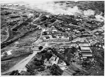 Photographic copy of 1947: Oblique aerial view from west-south-west of Ardeer, showing Administration buildings (centre), Africa House (foreground), and central area of factory (nitro-cellulose, acids etc) in middle distance.  (See also Overlay 'A' for details [D 10465]).