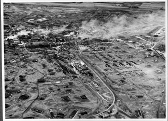 Photographic copy of 1947: Oblique aerial view from SE of Ardeer, showing Cordite Department (foreground), Detonators (right), Blasting (left), and Nitric Acid and Nitro-cotton (top left).  (See also Overlay 'D' for details [D 10471])