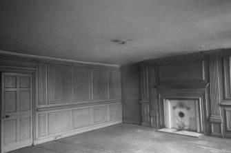 Interior view of Ambassador's House, 120 High Street, Linlithgow, showing paneled room with fire place.